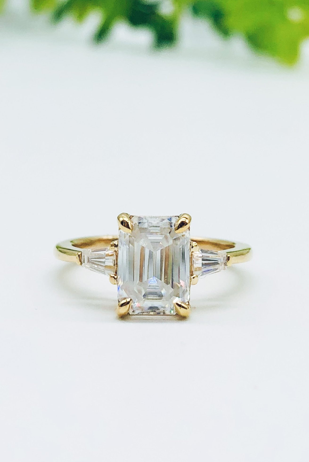 emerald-cut-three-stone-moissanite-engagement-ring