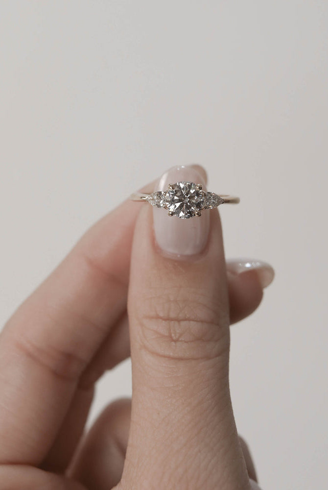 Round Three Stone Engagement Ring