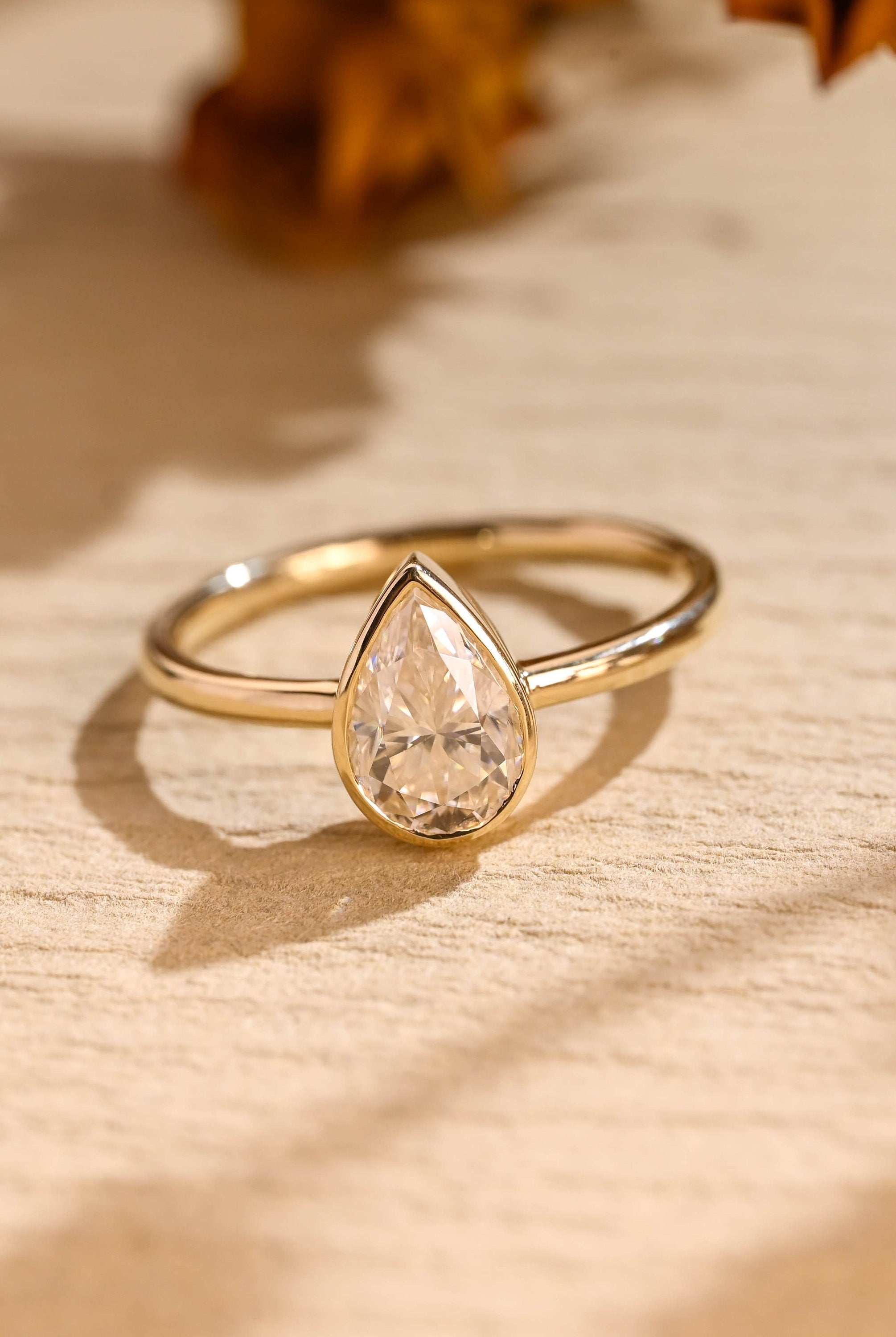 1 carat pear bezel engagement ring moissanite