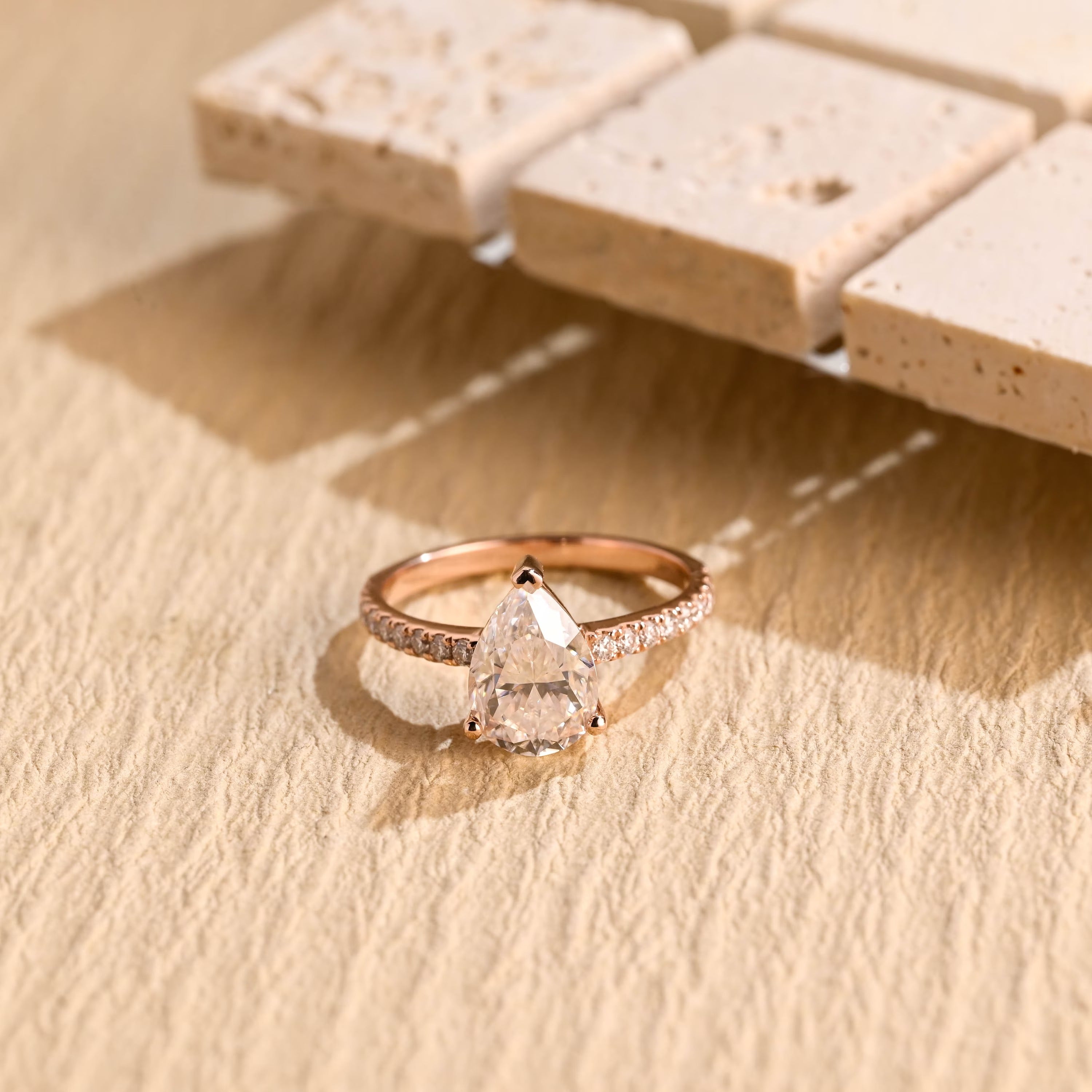 1 carat pear moissanite engagement ring pavé