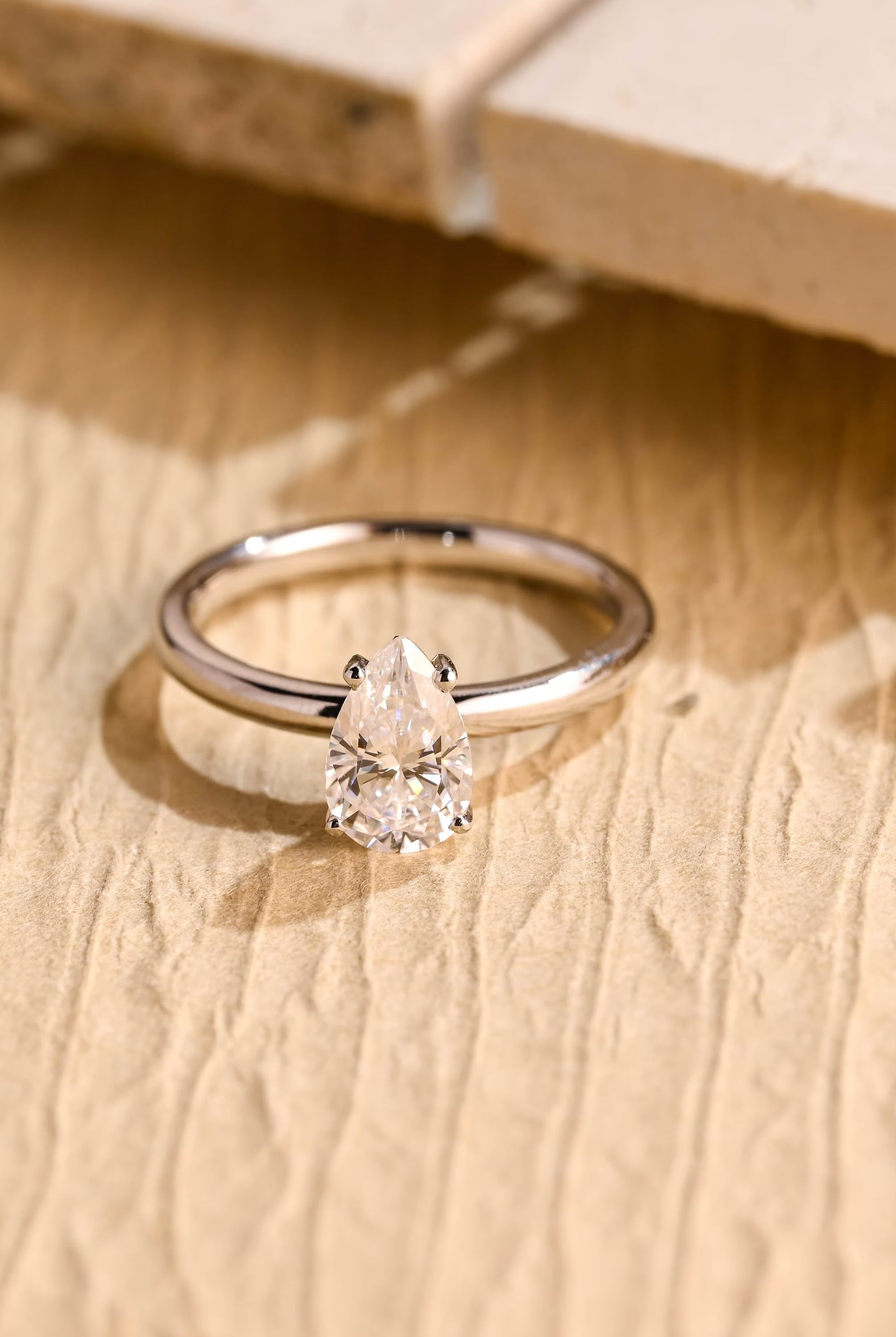 1 carat pear cut solitaire moissanite engagement ring