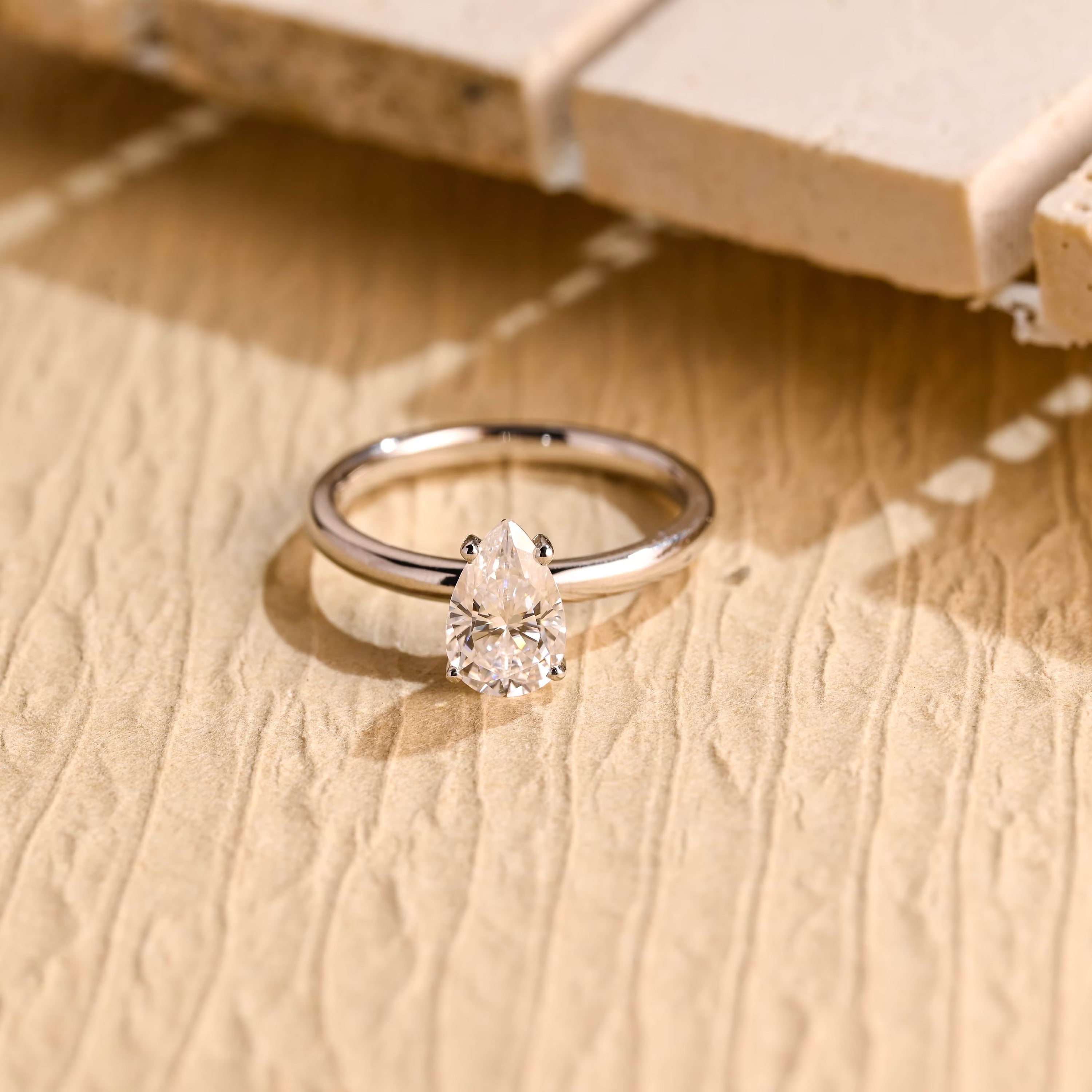 1 carat pear cut solitaire moissanite engagement ring