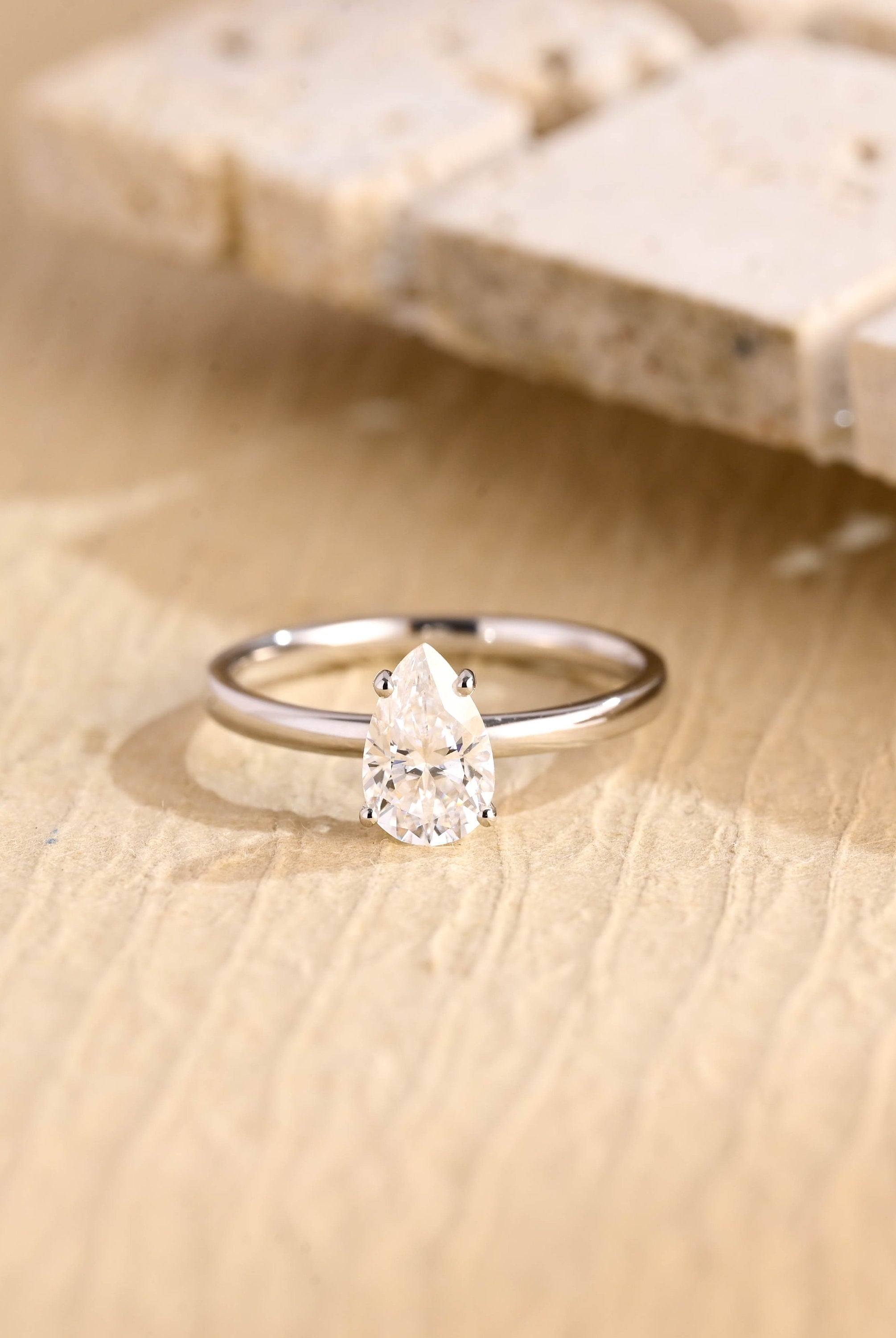 1 carat pear cut solitaire moissanite engagement ring