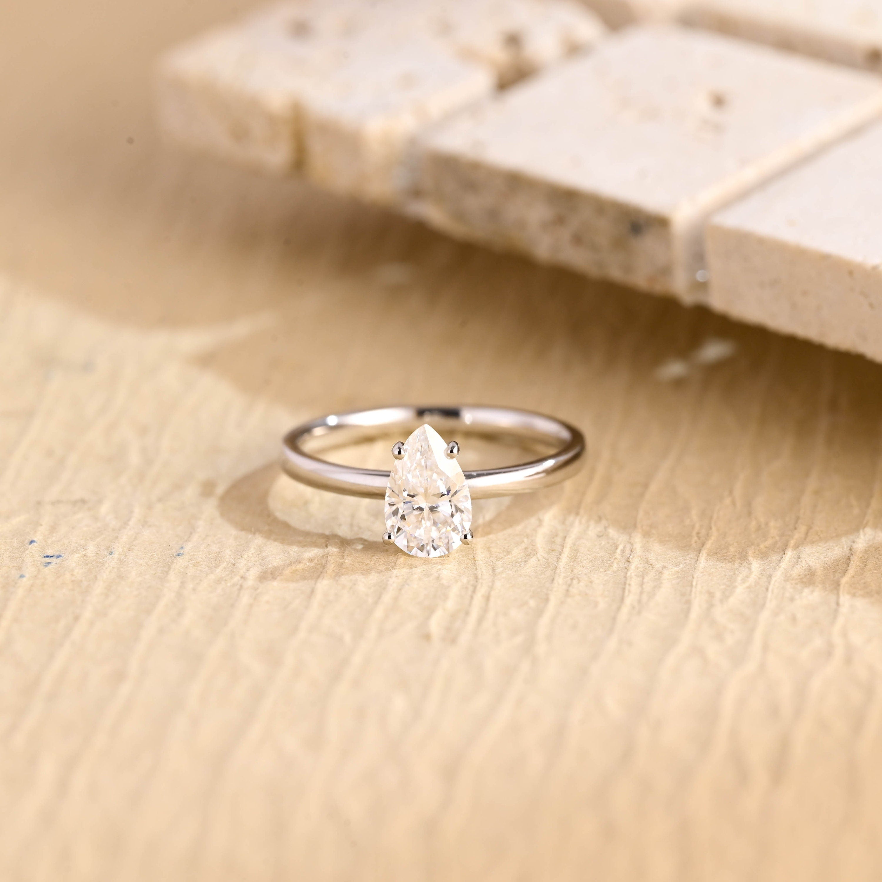 1 carat pear cut solitaire moissanite engagement ring