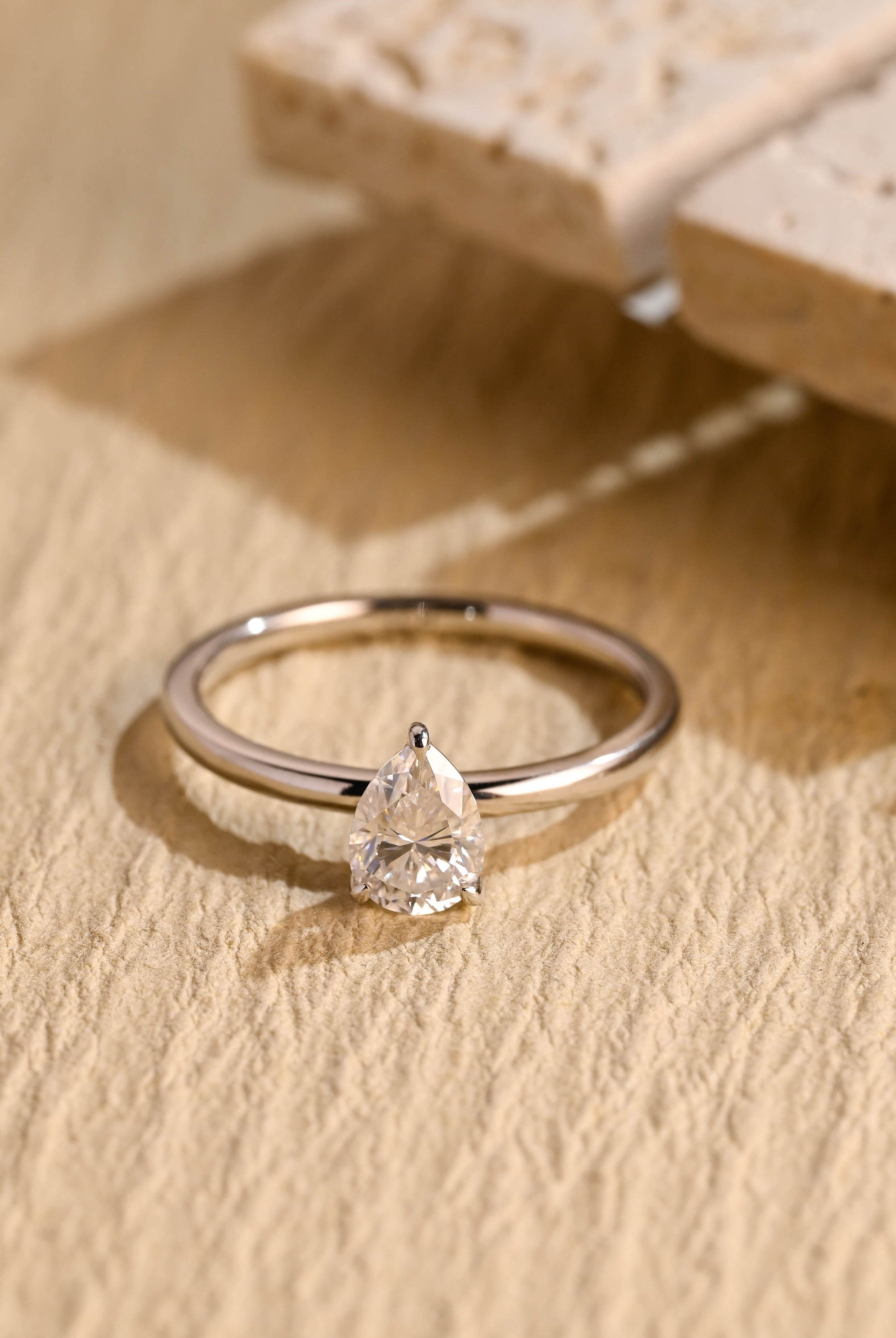 1 carat pear cut solitaire moissanite ring