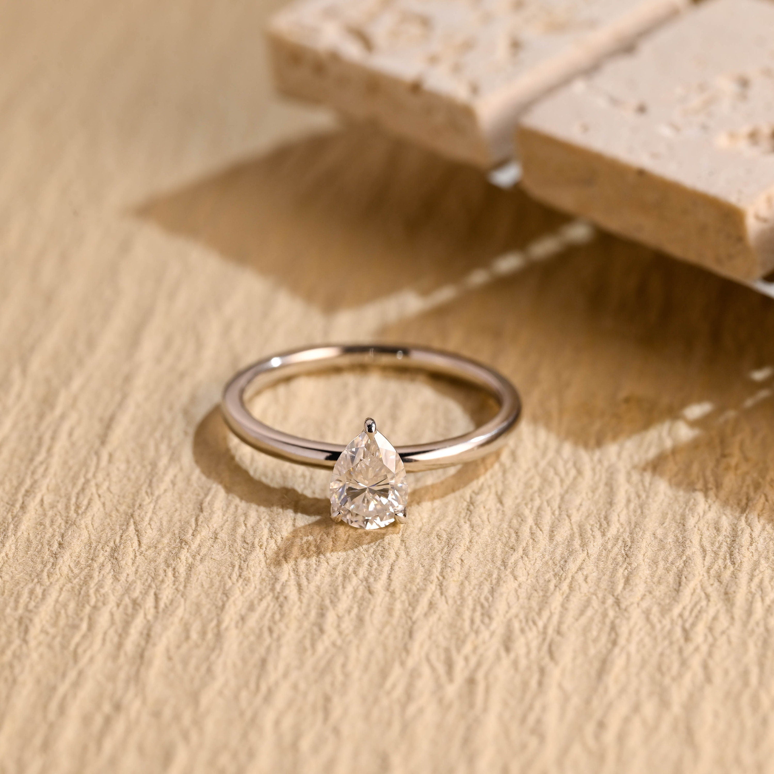 1 carat pear cut solitaire moissanite ring