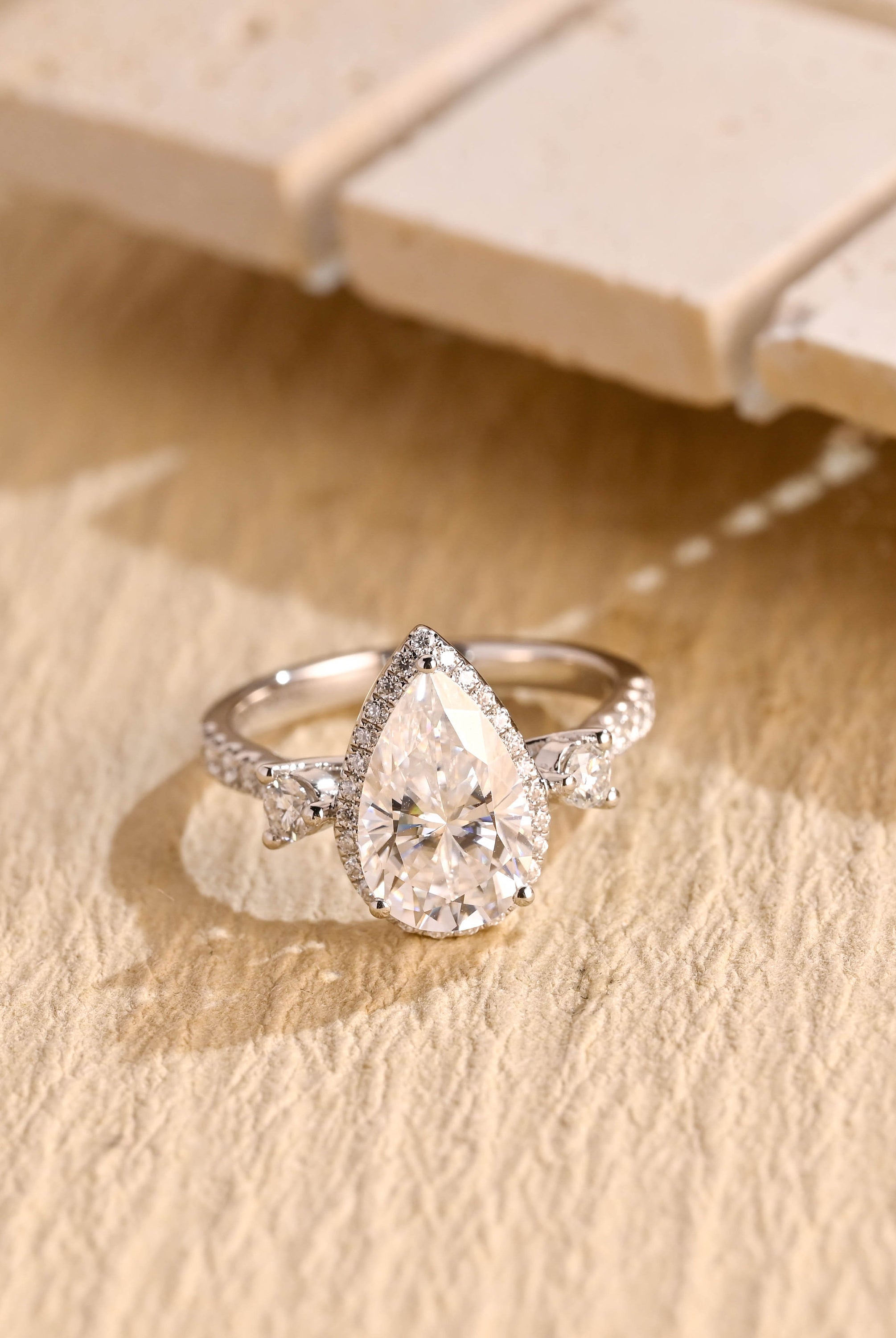 1 carat pear three stone engagement ring moissanite