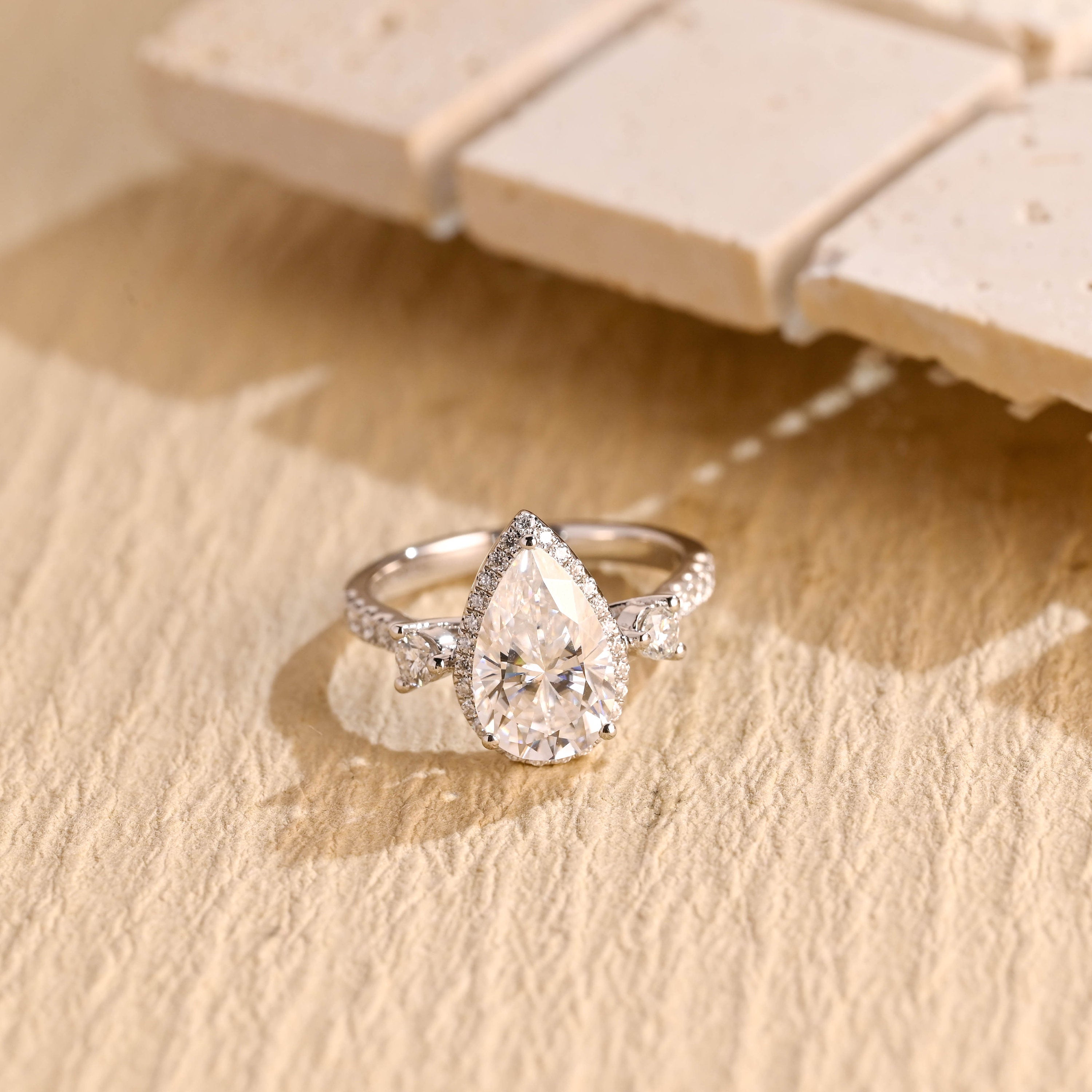 1 carat pear three stone engagement ring moissanite