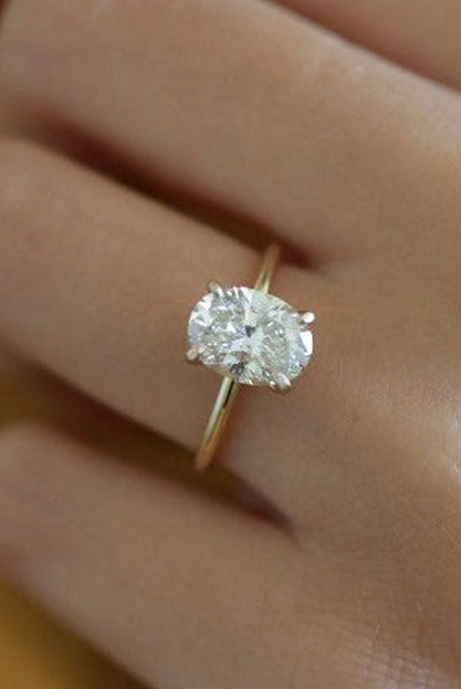 1.50ct Oval Four Prong Moissanite Diamond Solitaire Engagement Ring In 18K Yellow Gold
