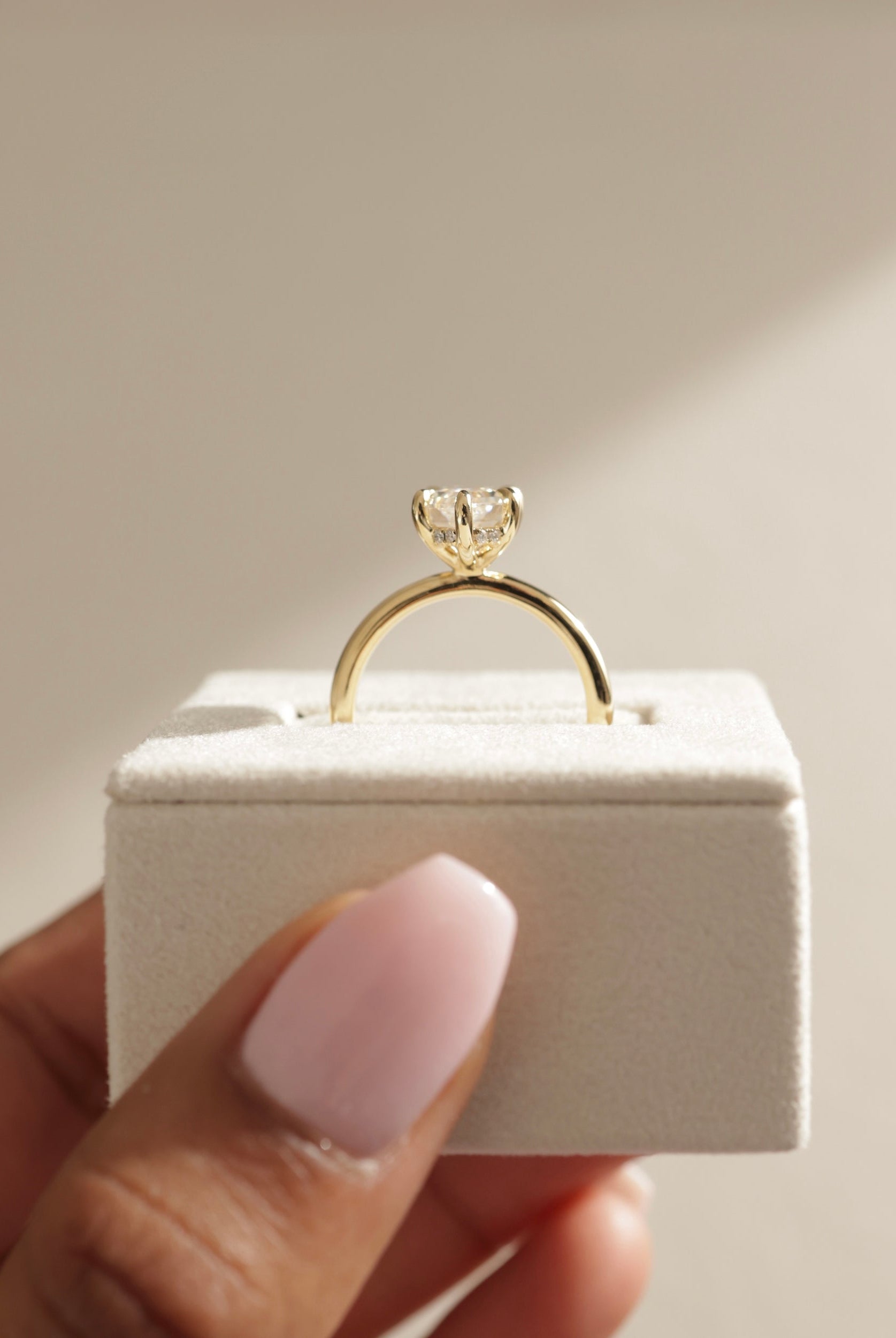 hidden halo engagement ring, hidden halo diamond ring, gold hidden halo ring, white gold hidden halo setting, rose gold hidden halo ring, kite diamond ring, kite cut diamond engagement rings