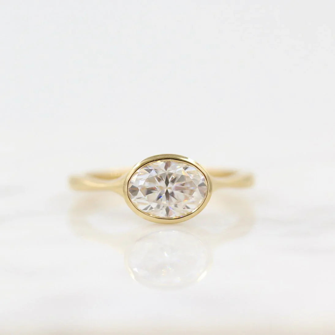 Oval Bezel Set Engagement Ring