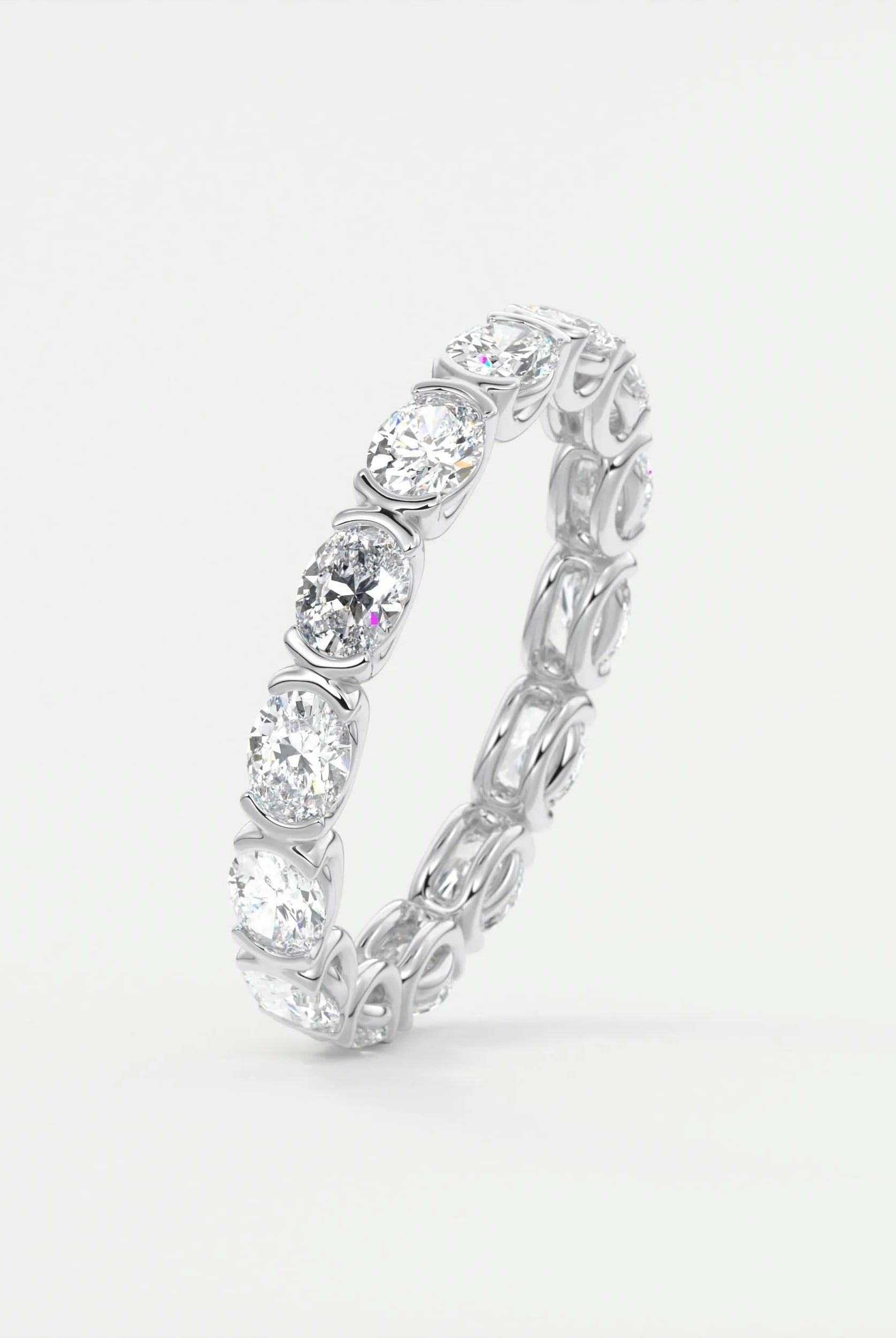 oval-cut-half-bezel-moissanite-bridal-wedding-band
