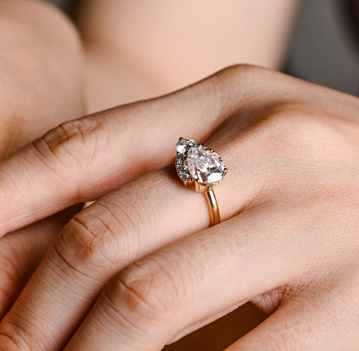 affordable luxury pear moissanite ring