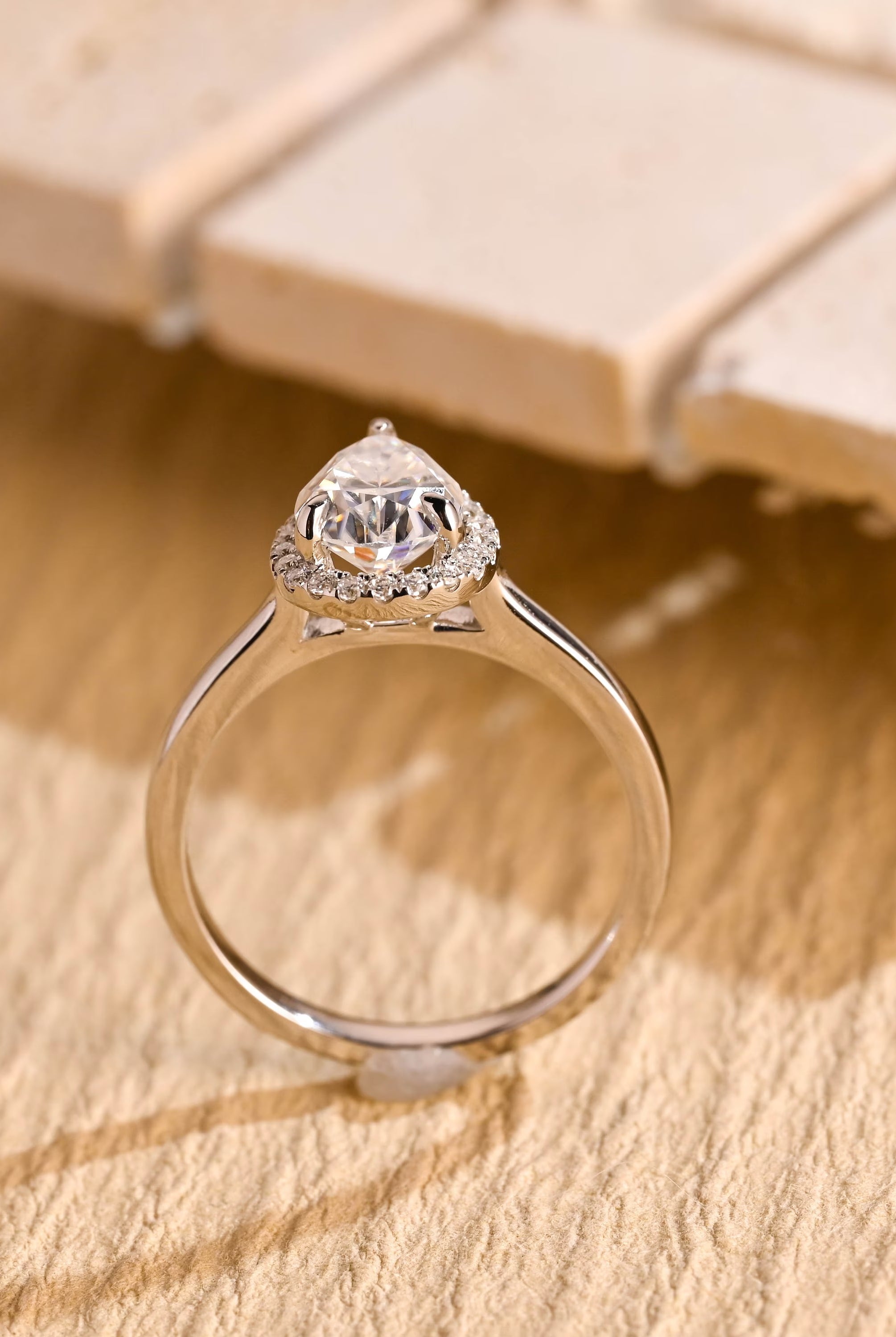 sustainable pear halo engagement ring moissanite