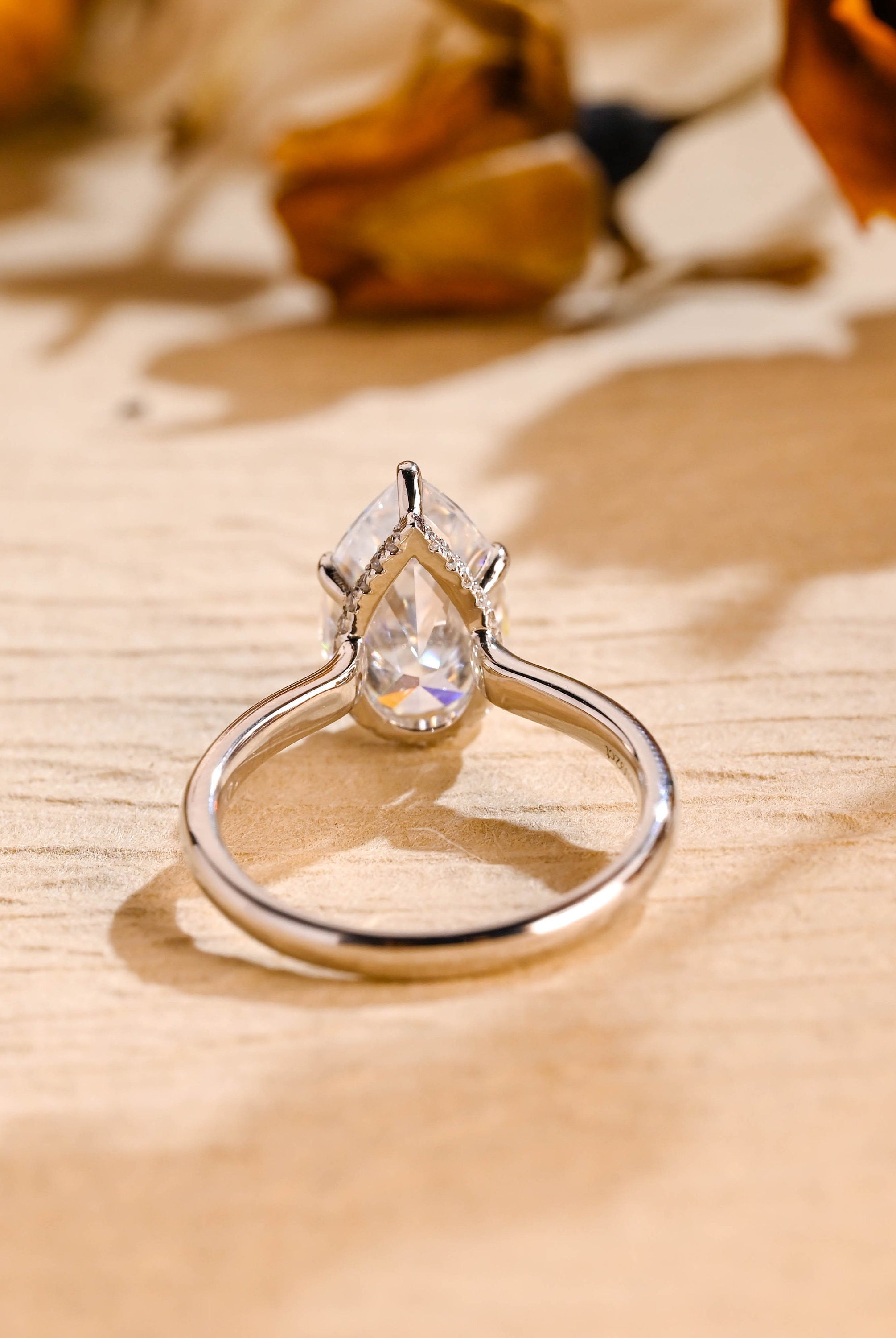 affordable luxury pear hidden halo moissanite ring