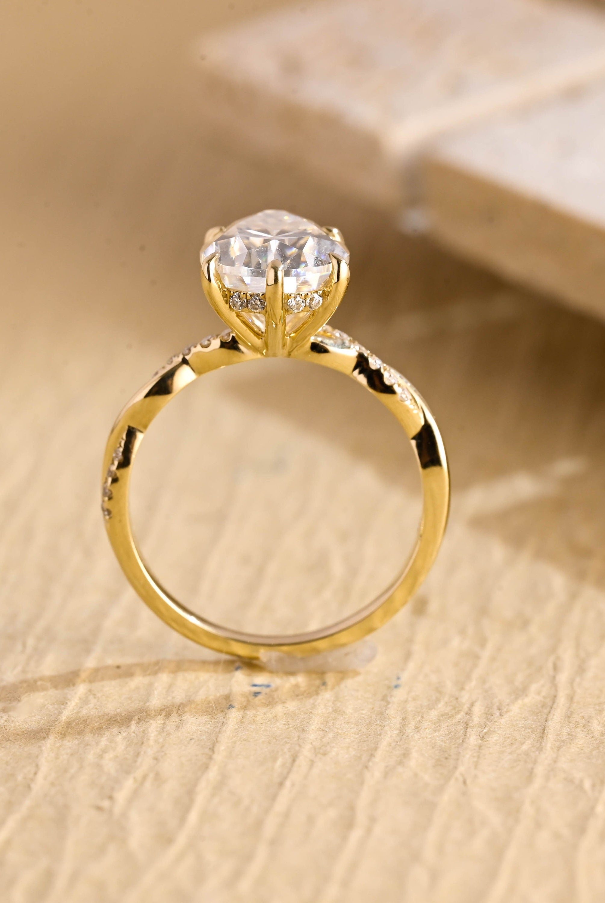 engagement ring pear twisted hidden halo moissanite