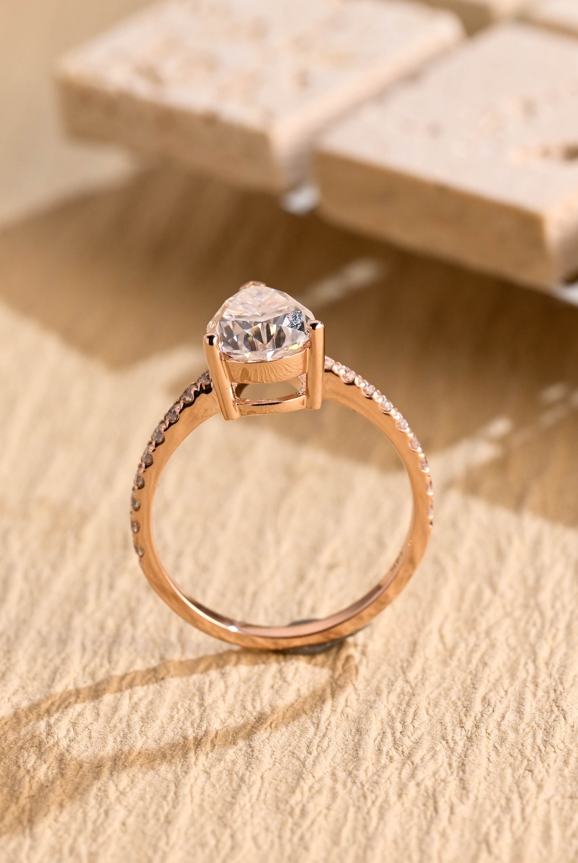 halo alternative pear pavé moissanite ring
