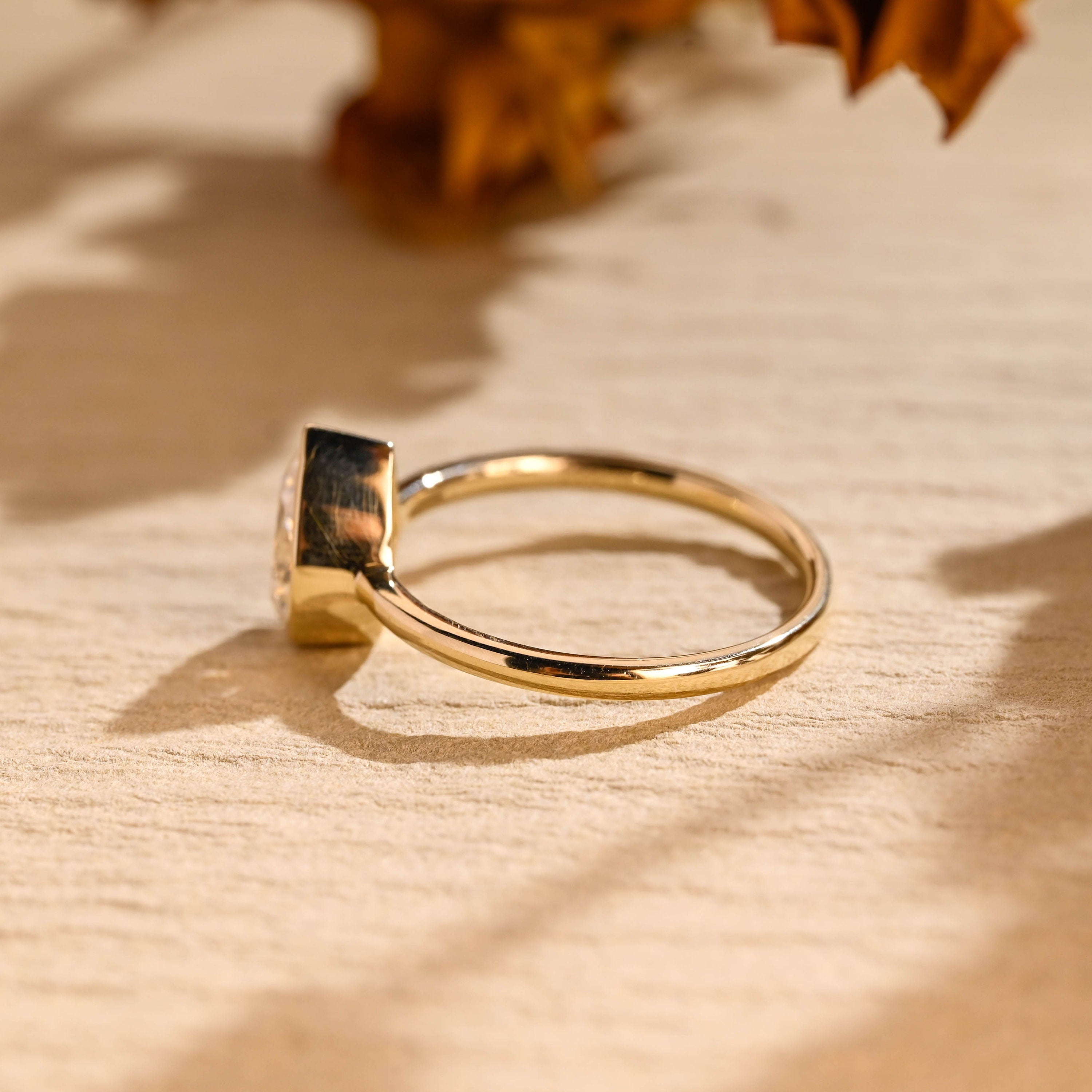 pear cut bezel solitaire engagement ring USA