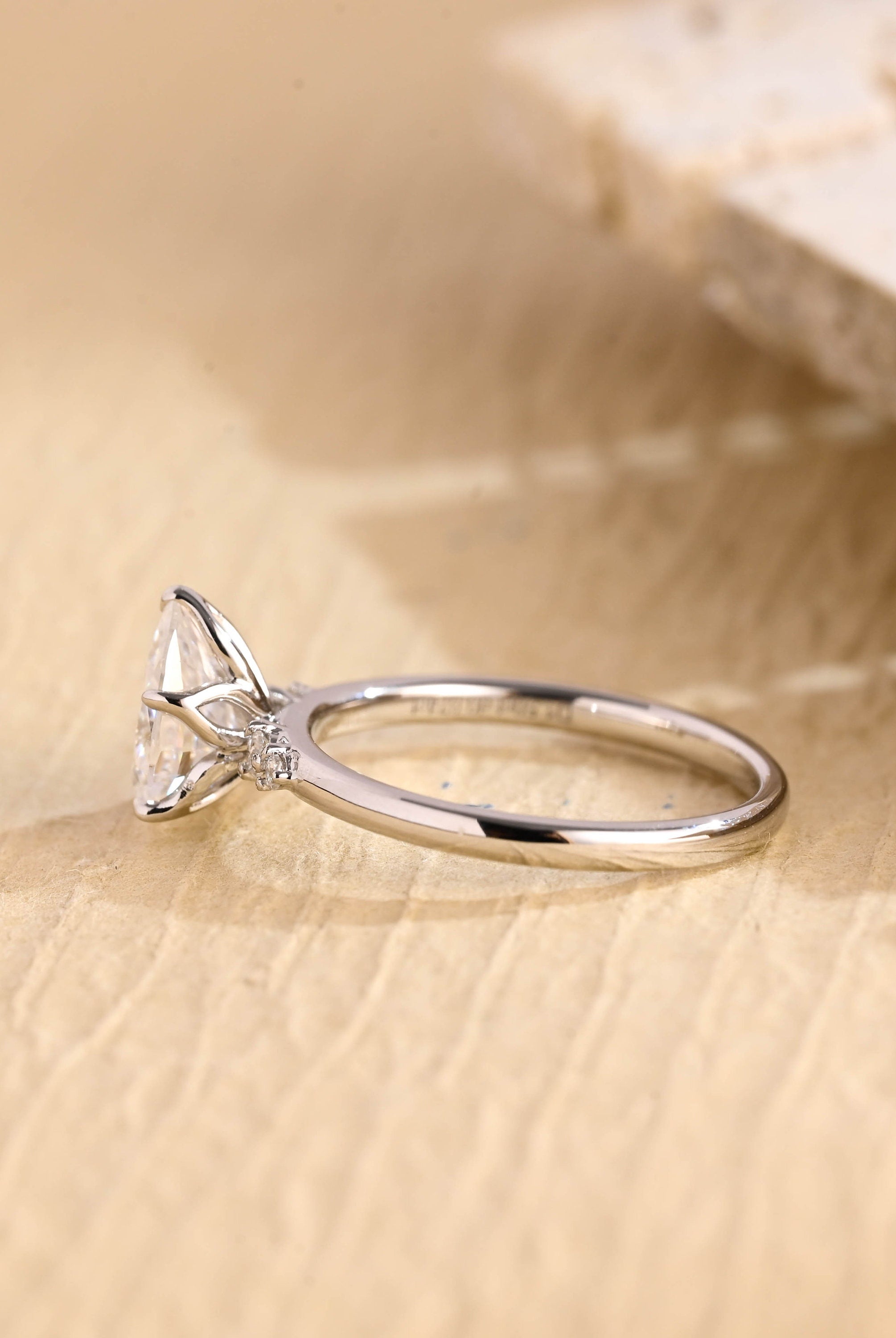 lab grown pear five stone engagement ring