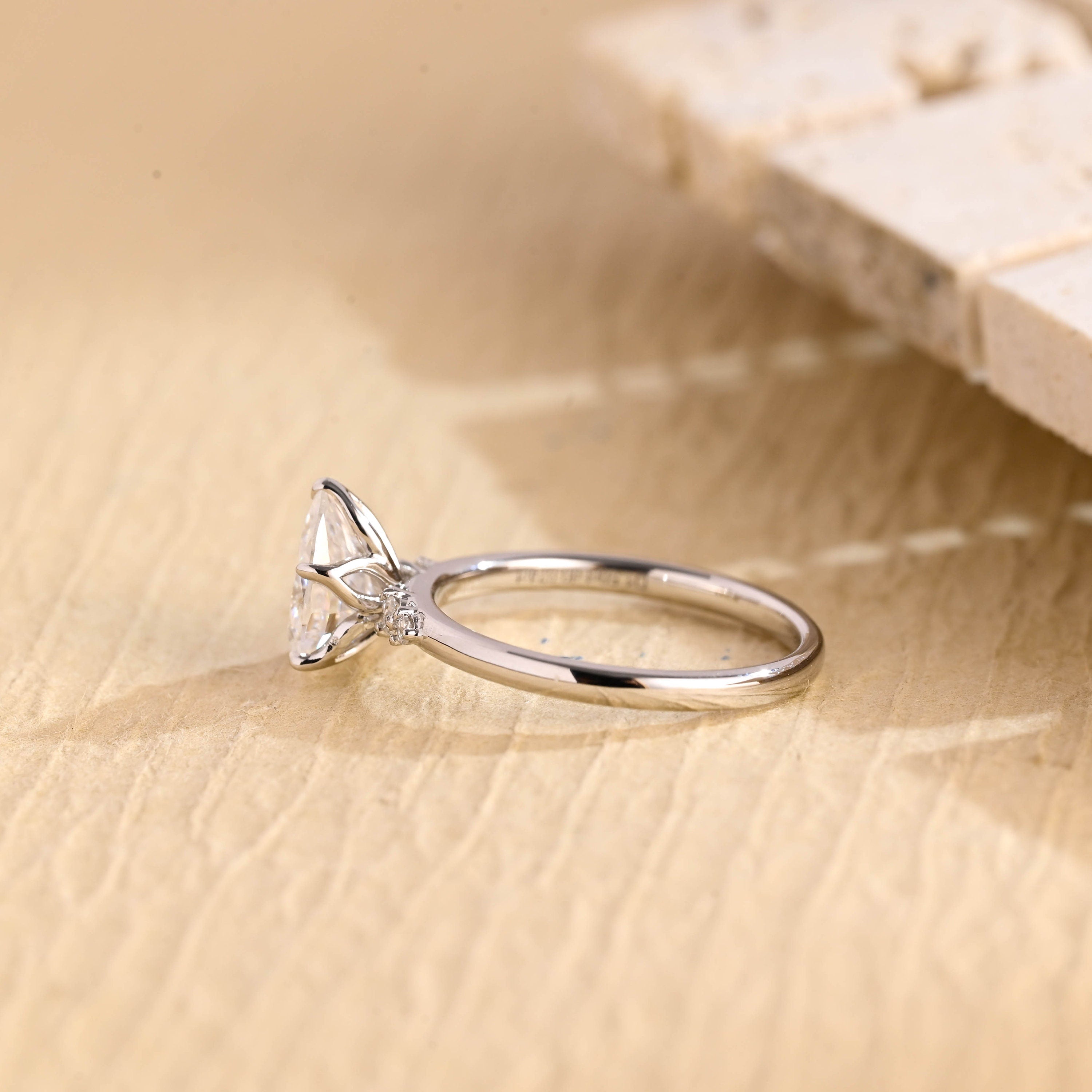 lab grown pear five stone engagement ring