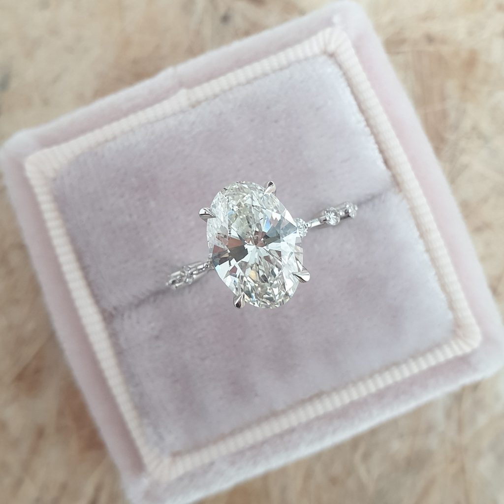 2.0ct Oval Petite Pave Moissanite Diamond Four Prong Engagement Ring In 18K Solid Gold