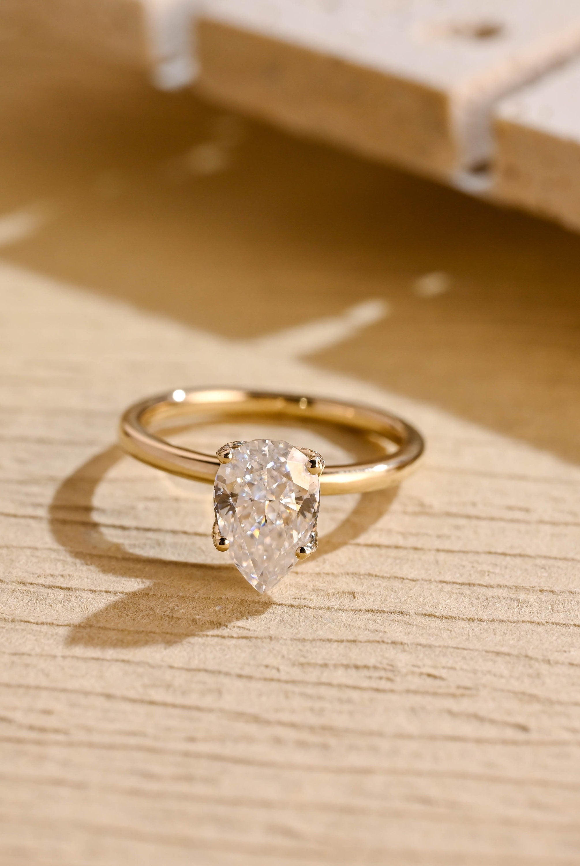 pear cut hidden halo moissanite engagement ring