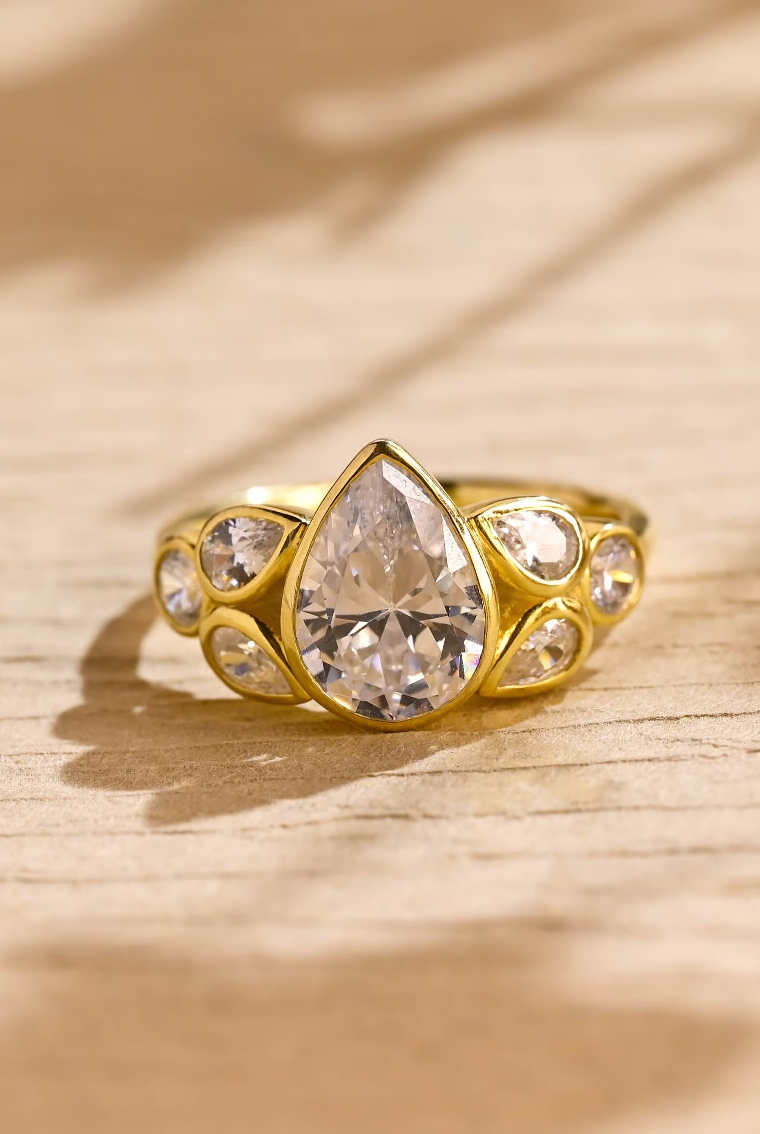 pear cut seven stone bezel moissanite engagement ring