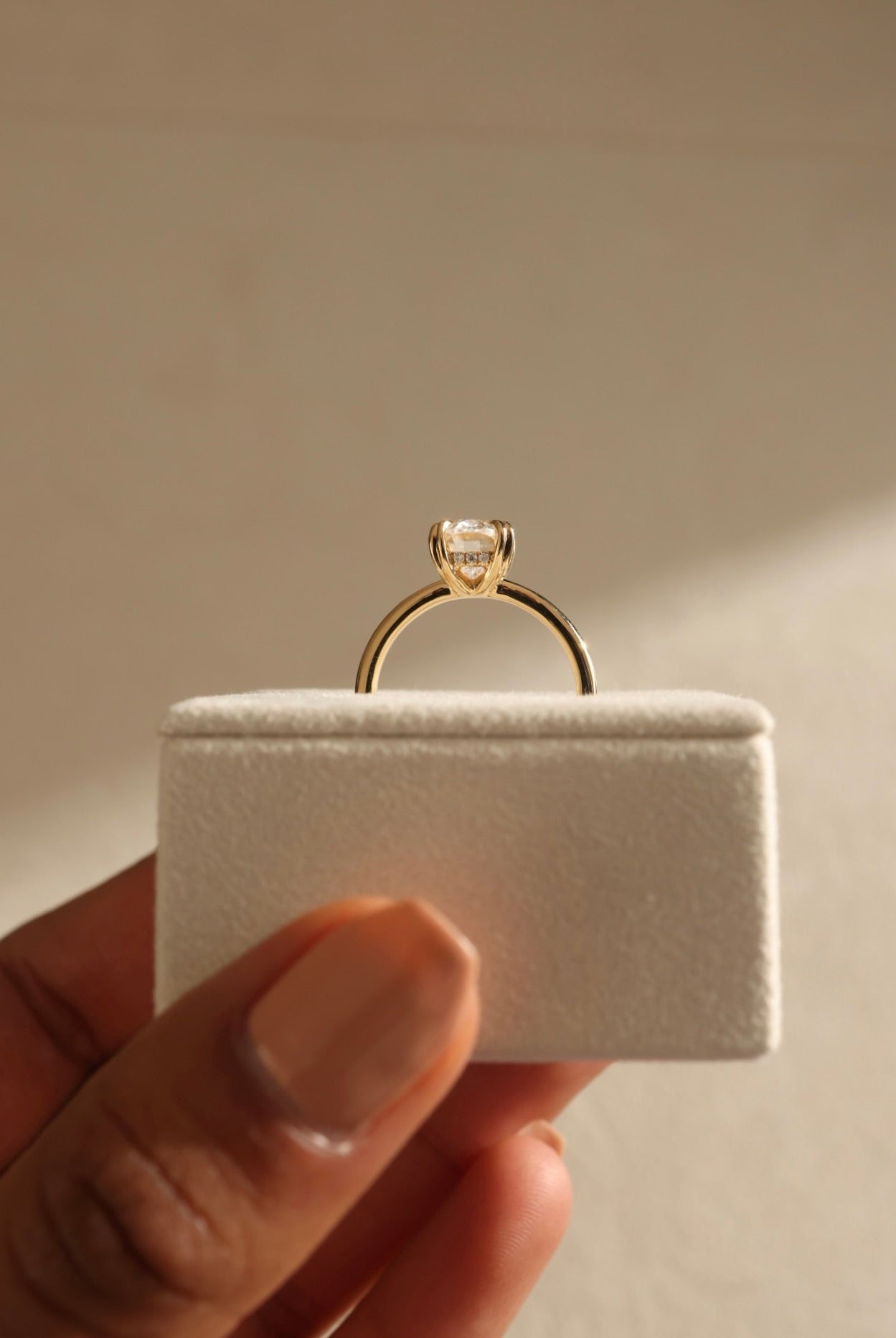 classic hidden halo engagement ring, handcrafted moissanite ring, modern oval cut ring, timeless oval solitaire, oval hidden halo bridal ring, luxury moissanite engagement ring, romantic oval cut ring, oval shaped moissanite ring