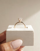 sparkling pear moissanite ring, affordable pear diamond alternative, moissanite hidden halo ring, unique pear engagement ring, pear cut moissanite solitaire ring, handcrafted hidden halo ring, timeless pear cut moissanite ring