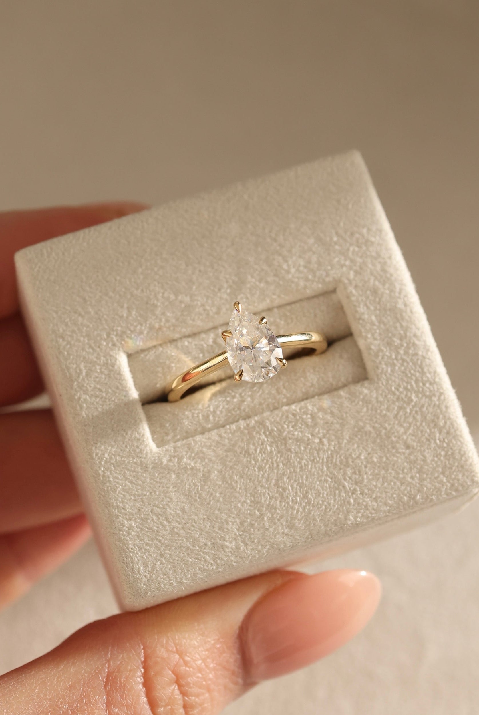 minimalist pear engagement ring, timeless pear cut solitaire, pear solitaire diamond alternative, romantic pear shape ring, pear moissanite solitaire for proposal, modern pear solitaire ring, luxury moissanite engagement ring