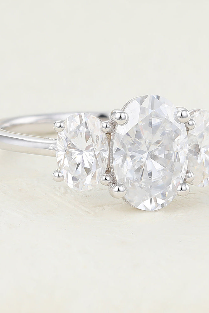 oval-shaped-moissanite-three-stone-engagement-ring