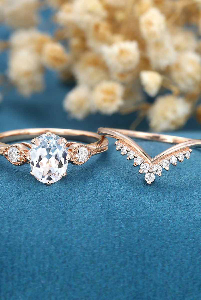 oval-shaped-moissanite-three-stone-bridal-set