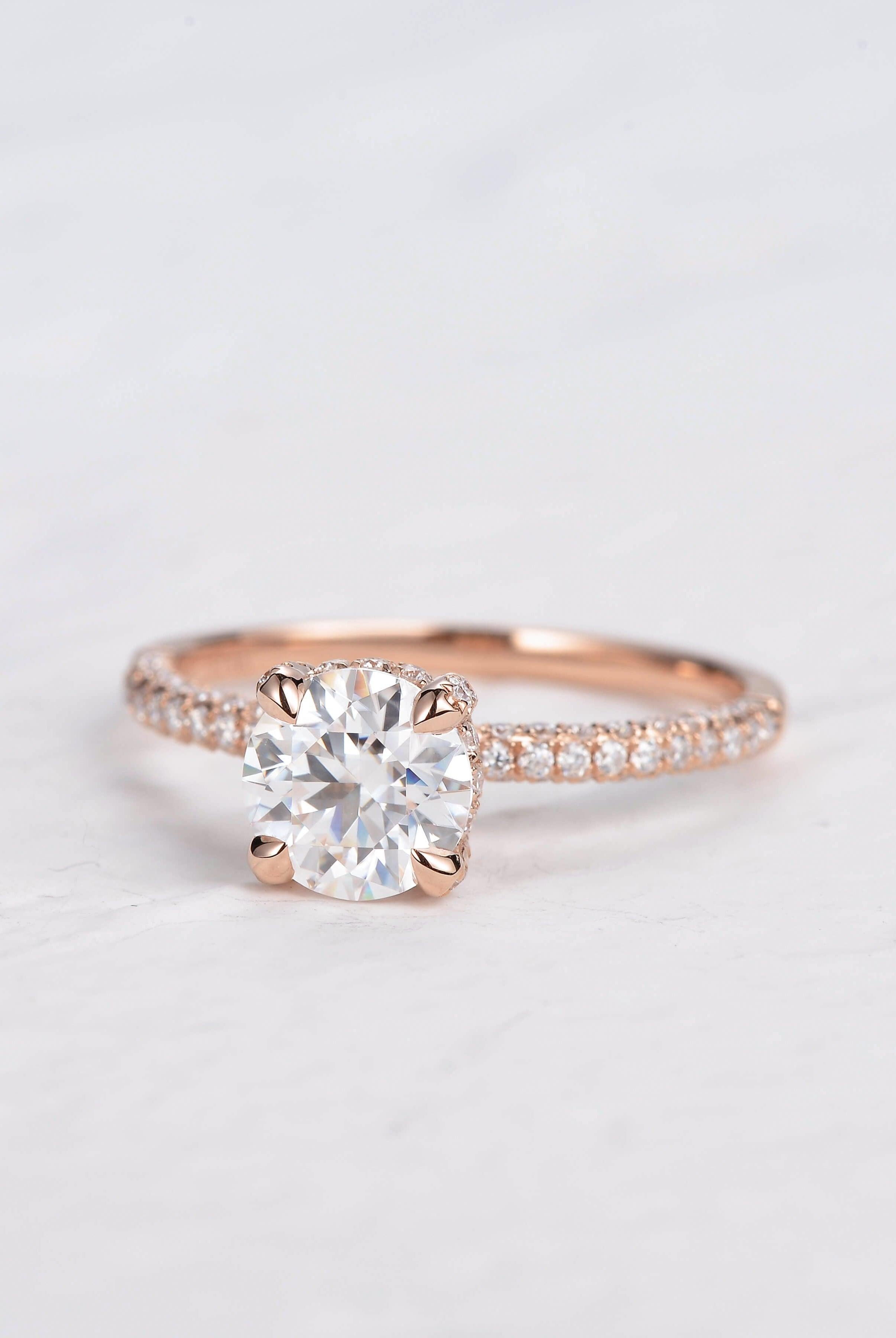 round-cut-solitaire-pave-moissanite-engagement-ring