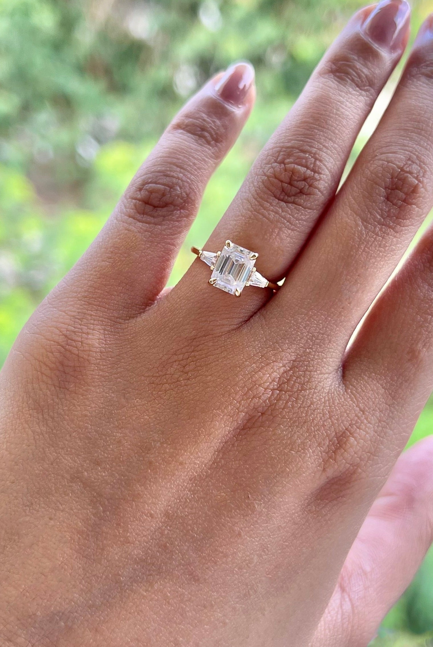 emerald-cut-three-stone-moissanite-engagement-ring
