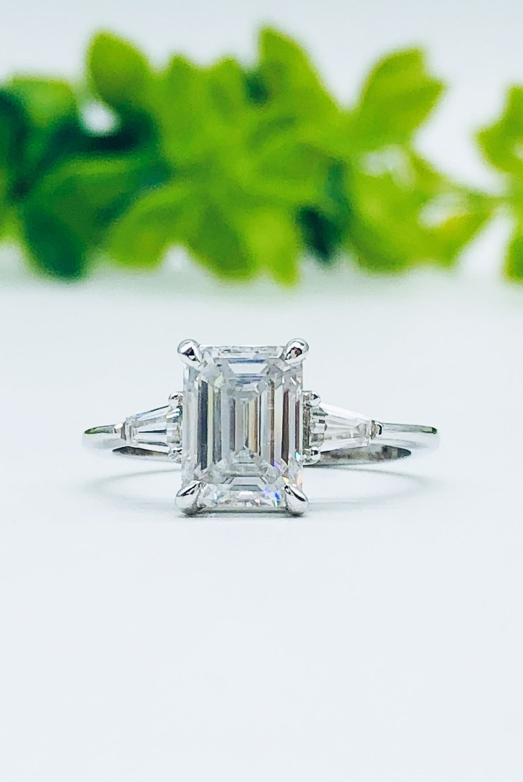 emerald-cut-three-stone-moissanite-engagement-ring