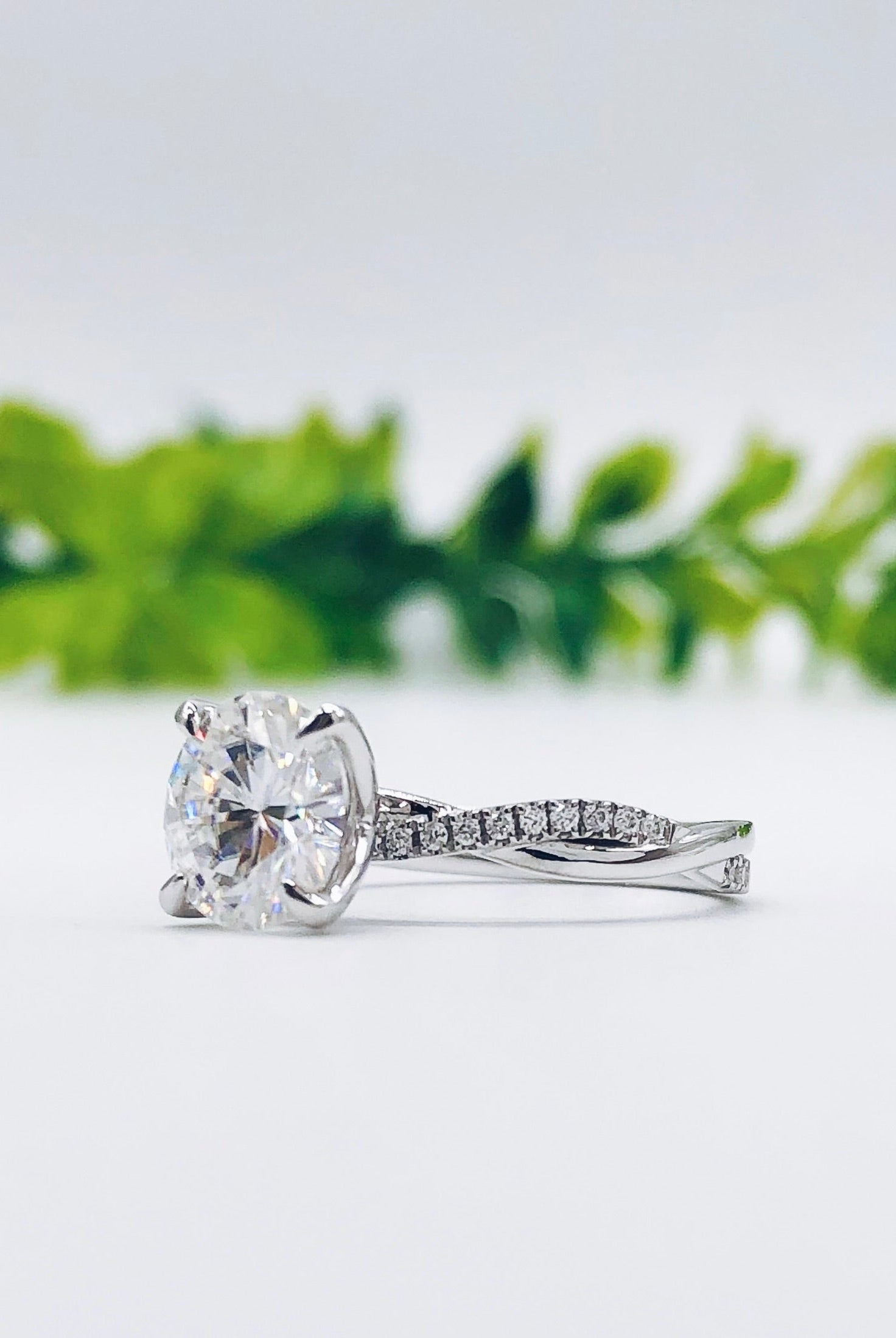 round-cut-solitaire-twisted-pave-moissanite-engagement-ring