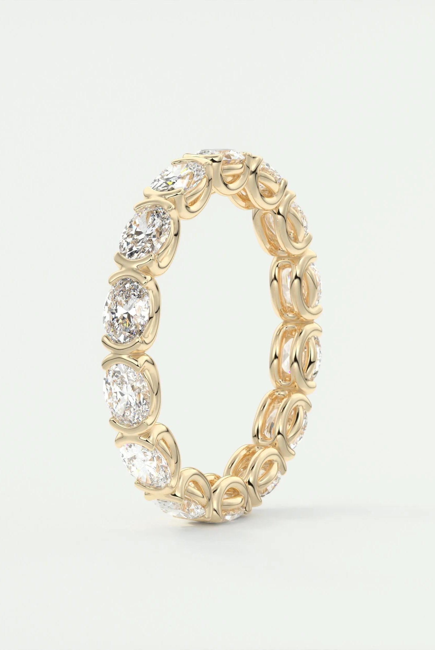 oval-cut-half-bezel-moissanite-bridal-wedding-band
