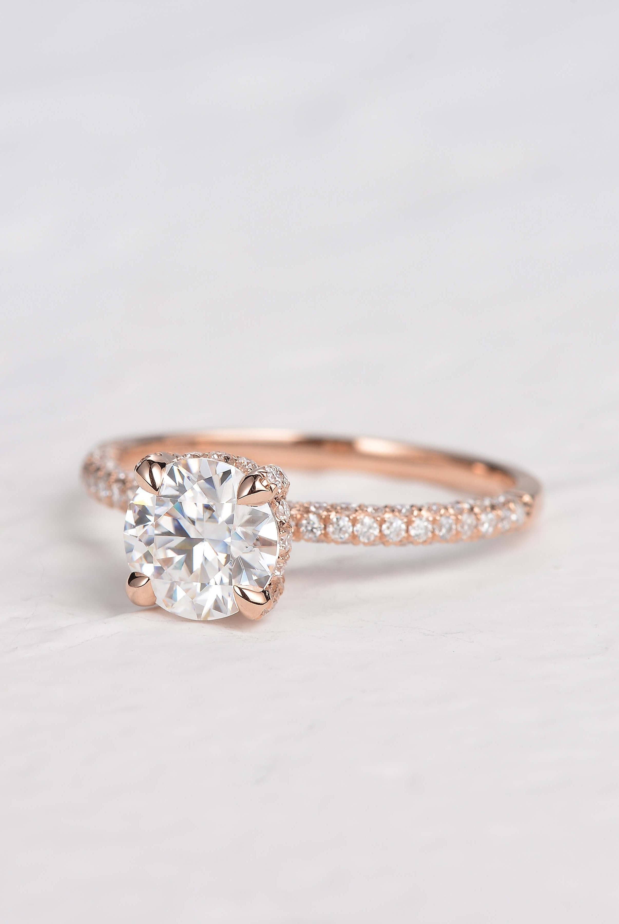 round-cut-solitaire-pave-moissanite-engagement-ring