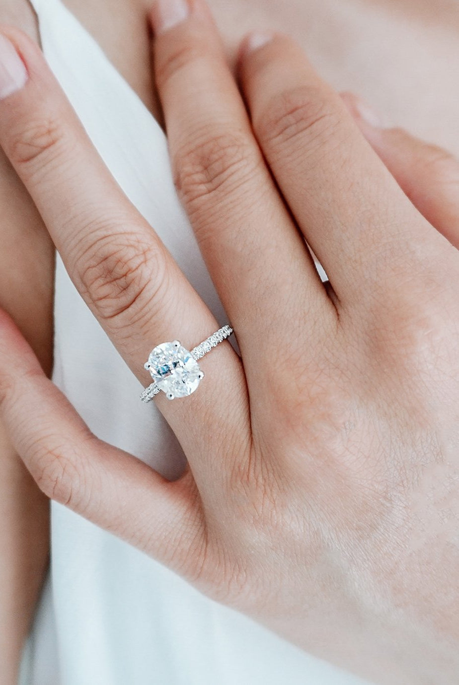 2-50-ct-oval-shaped-moissanite-hidden-halo-engagement-ring