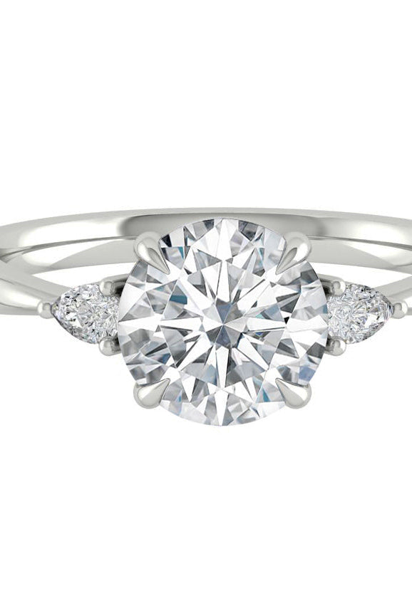 round-cut-three-stone-moissanite-engagement-ring