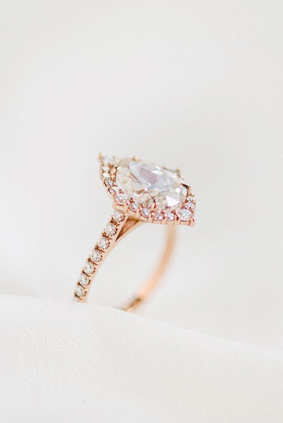 pear-cluster-halo-moissanite-engagement-ring