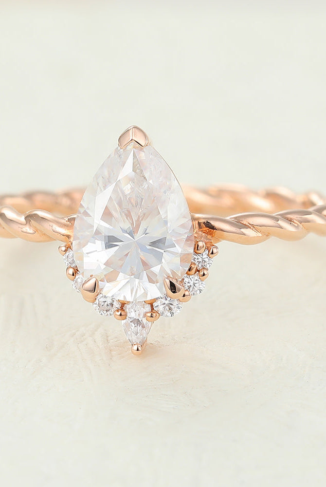 pear-shaped-moissanite-cluster-engagement-ring