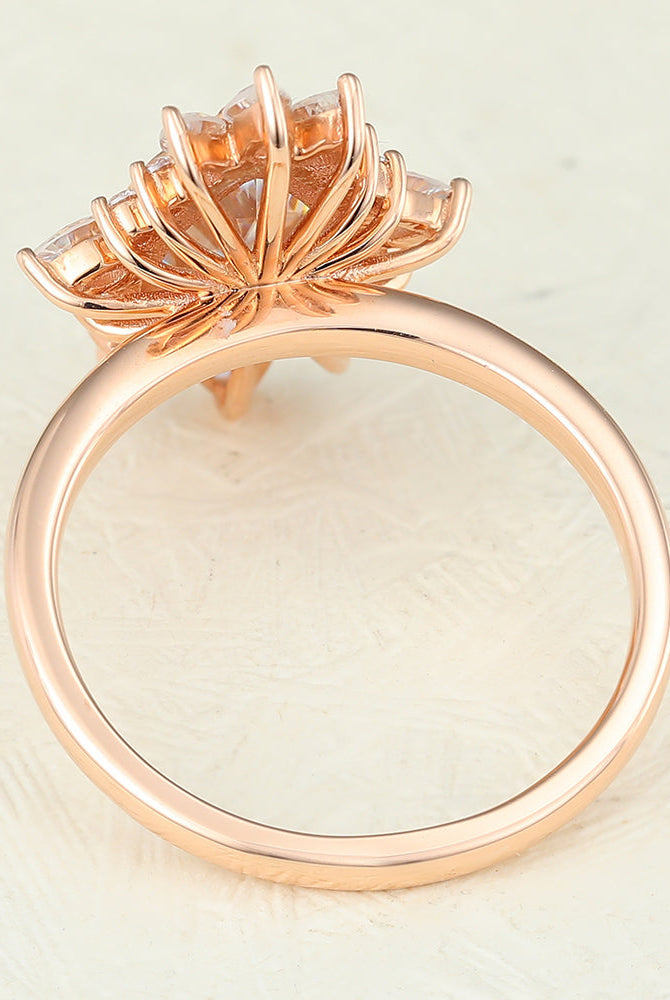 0-57-ct-pear-shaped-moissanite-cluster-halo-engagement-ring