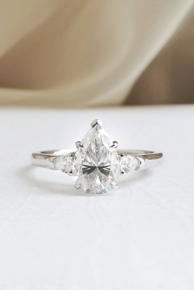 1-50-ct-pear-shaped-moissanite-three-stone-engagement-ring