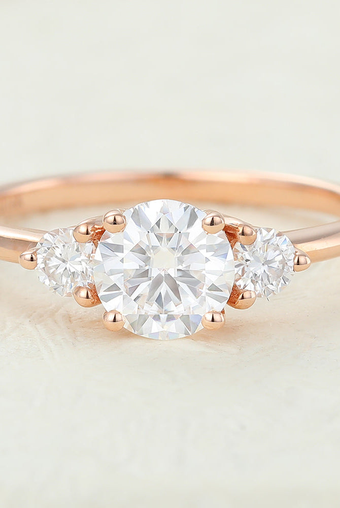 0-68-ct-round-shaped-moissanite-three-stone-engagement-ring