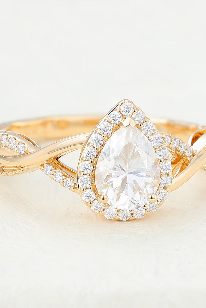pear-shaped-moissanite-halo-twisted-pave-engagement-ring
