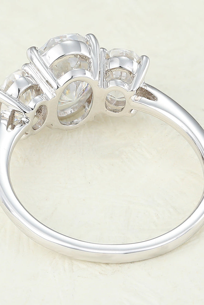 oval-shaped-moissanite-three-stone-engagement-ring