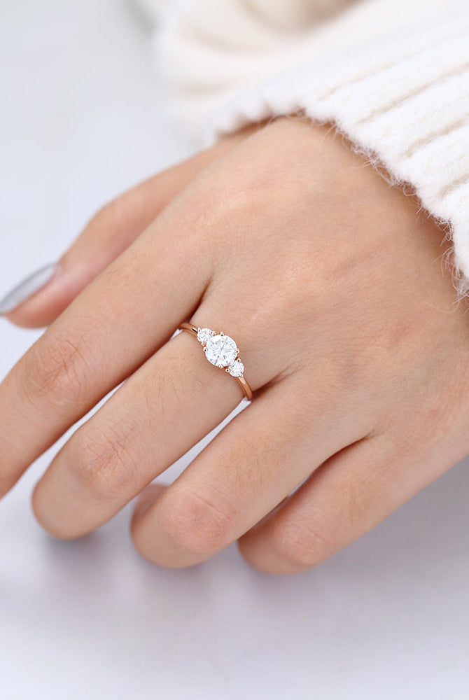 0-68-ct-round-shaped-moissanite-three-stone-engagement-ring