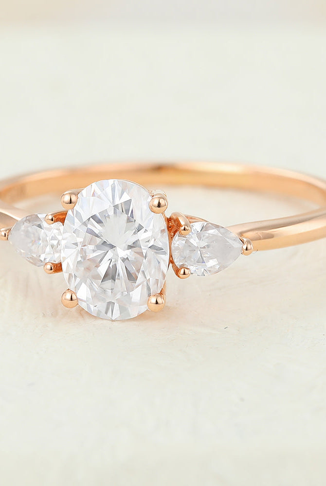 oval-shaped-moissanite-three-stone-engagement-ring