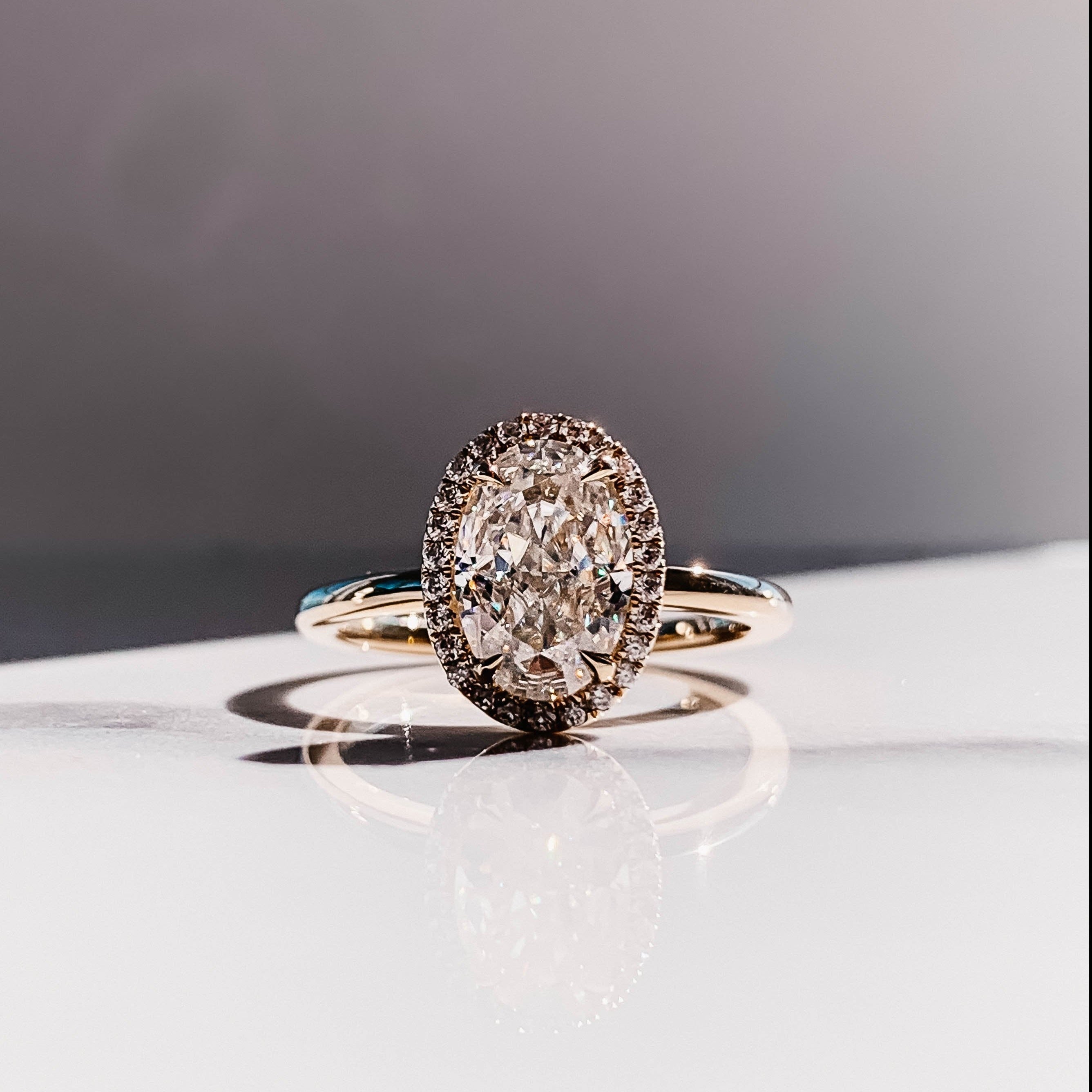 2.0CT Oval Four Prong Moissanite Diamond Halo Engagement Ring In 18K Yellow Gold